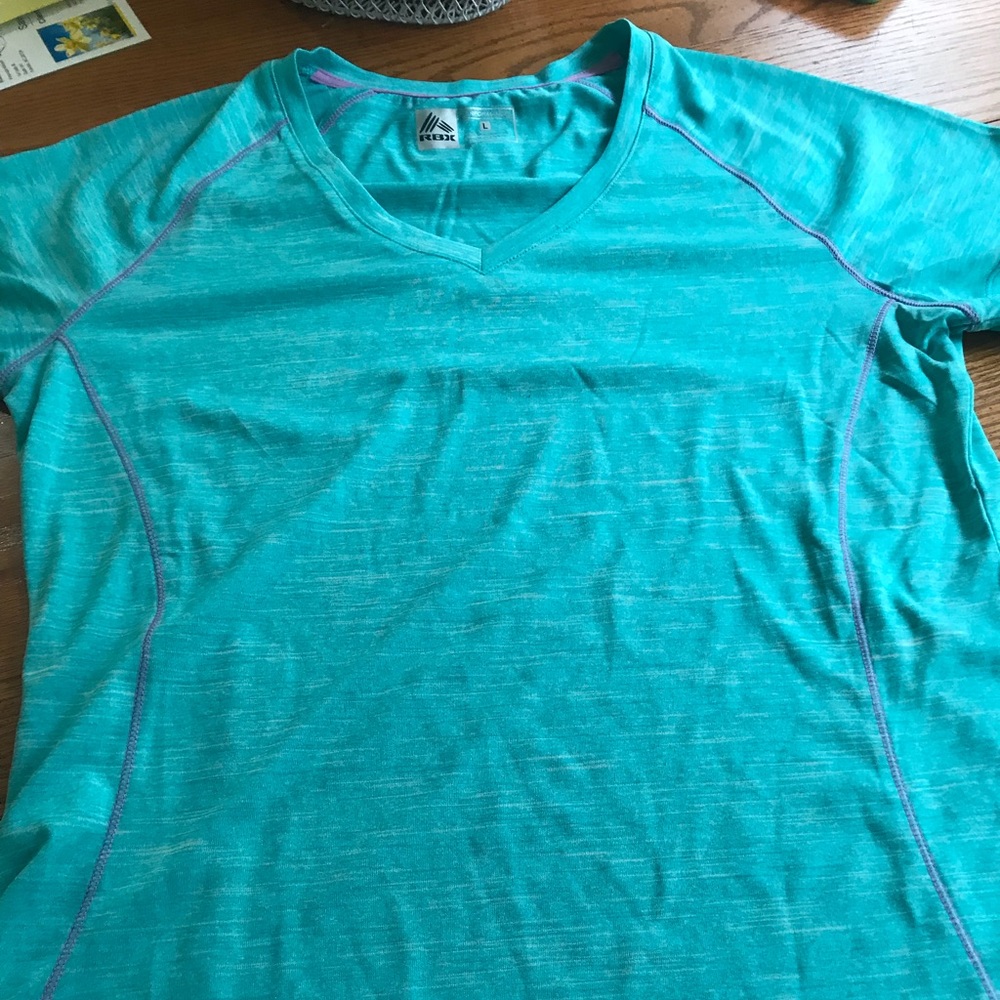 Women’s green athletic shirt.